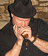 Jimi Lee using his BlowsMeAway Productions wood microphone